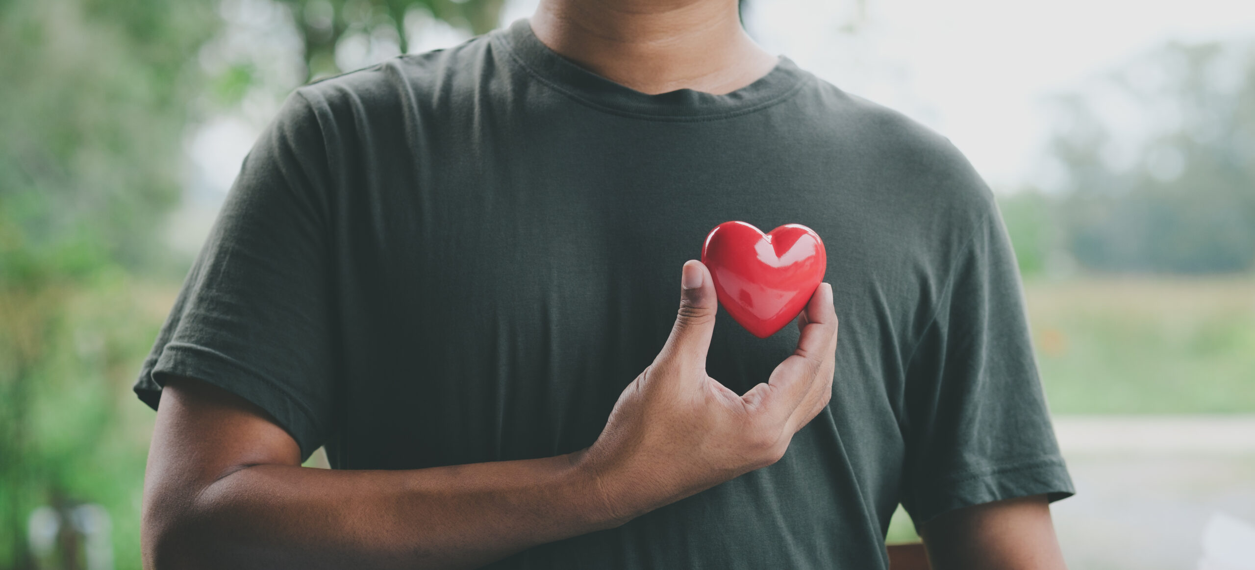 Hand holding red heart, World health day, Health care and mental